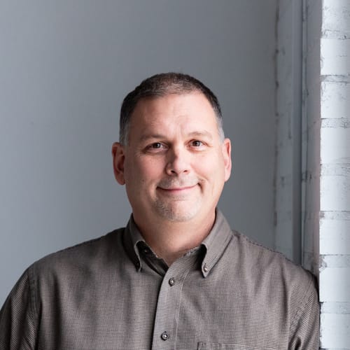 Headshot of Eddie Traughber, LMFT