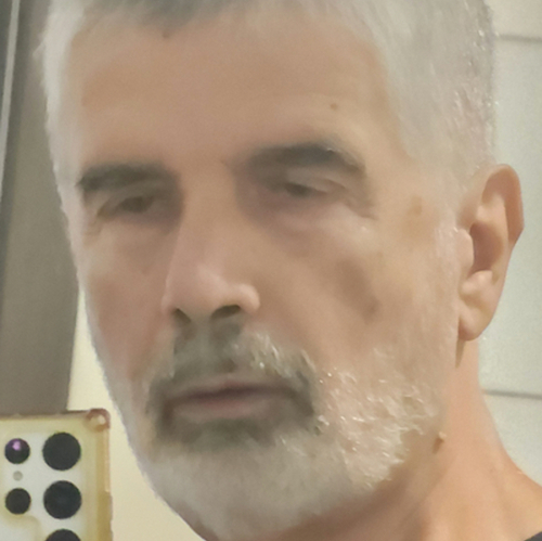 Headshot of Dino Koutsolioutsos, LMFT