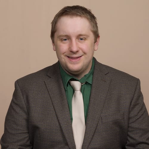 Headshot of Justin Delyani, LMHC