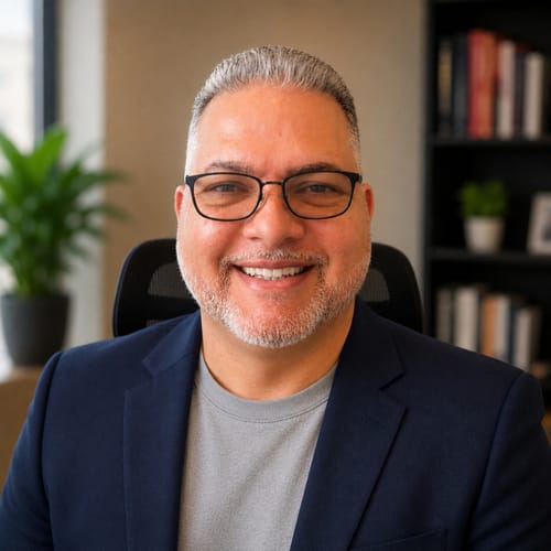 Headshot of Carlos Feliciano Rodriguez, APRN