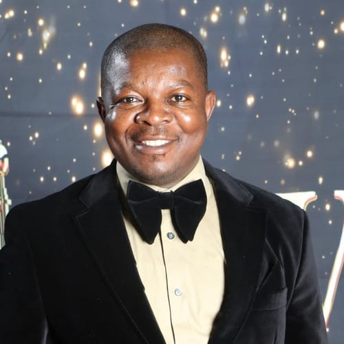 Headshot of Olumide Akinwumi, NP