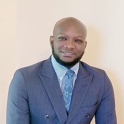 Headshot of Badu Adjei, APRN
