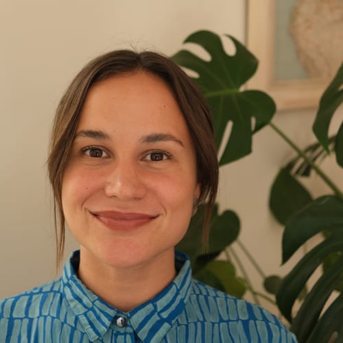 Headshot of Isabela Barros Doyle, CP
